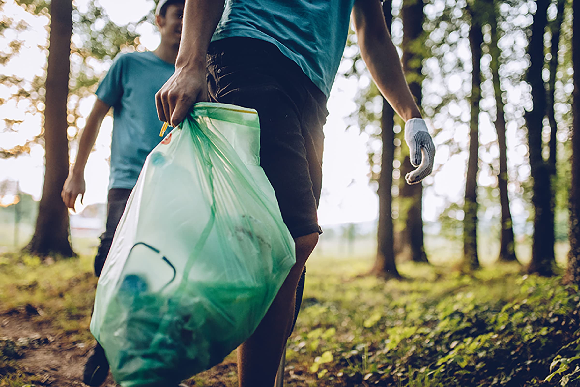 Group of volunteers collecting garbage in park