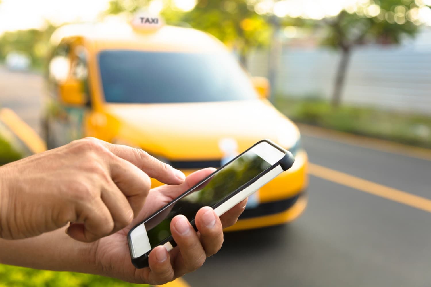Man orders a taxi from his cell phone